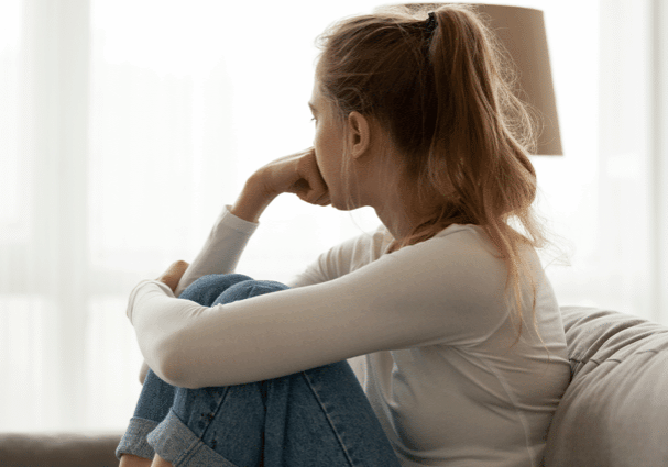 Girl looking out window